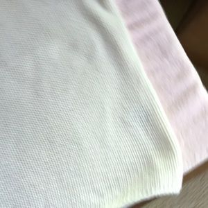 Cute short sleeve white sweater. Bulky and loose